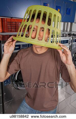 Stock Image - Basket on his head. Fotosearch