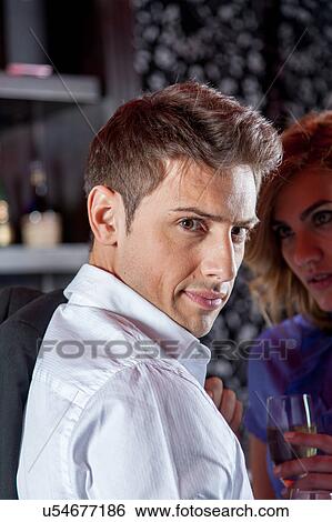 Stock Photograph - Beautiful man holding a wineglass. Fotosearch