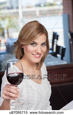 Stock Photography - Beautiful woman making a toast. Fotosearch