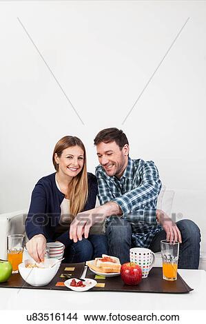Picture - Beutifull couple having a breakfast. Fotosearch