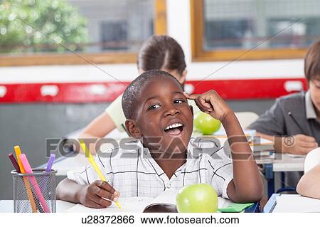 Stock Photograph - black boy thinking. Fotosearch