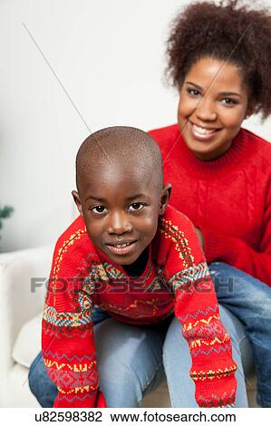 Black boy with his mom View Large Photo Image Stock Image - Black boy with his mom. Fotosearch