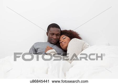 Black couple in love in the bed View Large Photo Image Stock Image - Black couple in love in the bed. Fotosearch