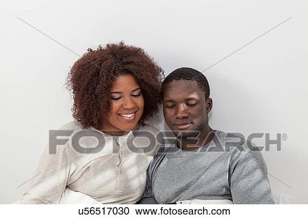 Black couple using the ipad View Large Photo Image Stock Image - Black couple using the ipad. Fotosearch
