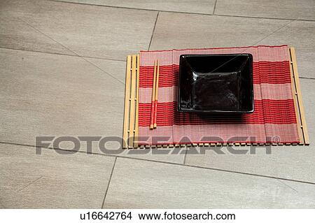 Picture - black dish of sushi. Fotosearch