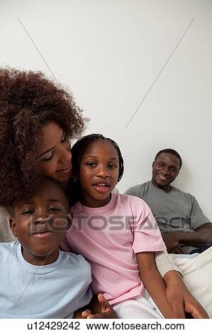 Black family in the bed View Large Photo Image Stock Image - Black family in the bed. Fotosearch