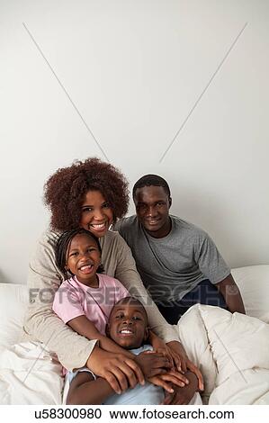 Black family in the bed View Large Photo Image Stock Image - Black family in the bed. Fotosearch