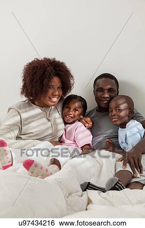 Black family in the bed View Large Photo Image Stock Photograph - Black family in the bed. Fotosearch