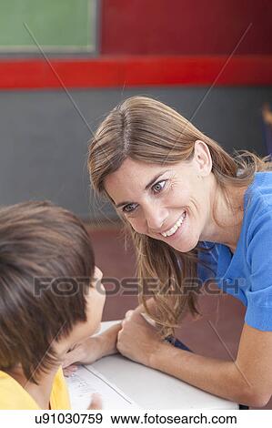 Boy and teacher looking at eachother View Large Photo Image Stock Photo - Boy and teacher looking at eachother. Fotosearch