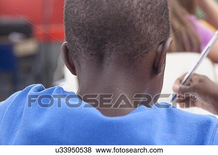 Stock Photo - Boy doing the activity of math. Fotosearch