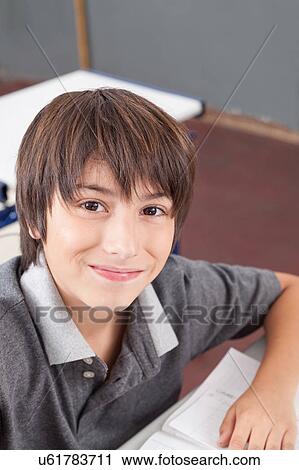 Stock Image - boy in the classroom. Fotosearch