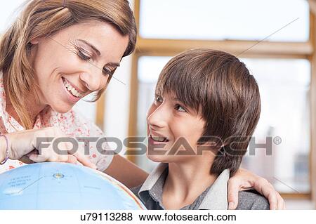 Stock Photo - boy learning geography. Fotosearch