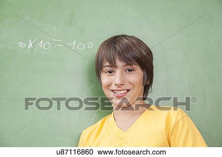 Stock Image - Boy looking at camera. Fotosearch