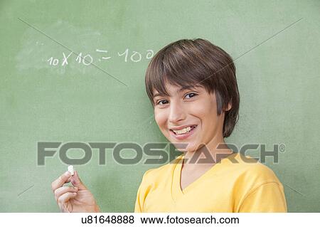 Stock Photo - Boy looking at camera. Fotosearch