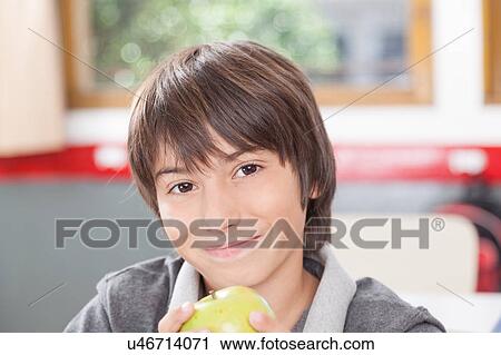 Boy sharing a apple View Large Photo Image Stock Image - Boy sharing a apple. Fotosearch