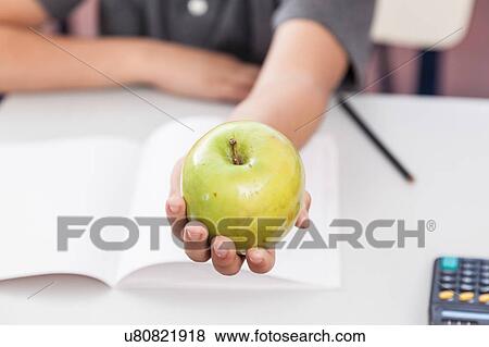 Stock Photo - Boy sharing a apple. Fotosearch