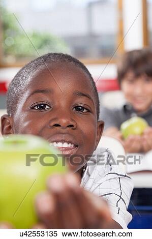 Stock Photography - Boy sharing a apple. Fotosearch