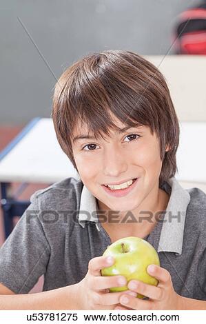 Stock Photography - Boy sharing a apple. Fotosearch