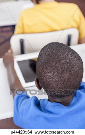 Boy studing at school View Large Photo Image Picture - Boy studing at school. Fotosearch