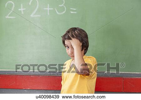 Stock Photo - Boy worried about math. Fotosearch