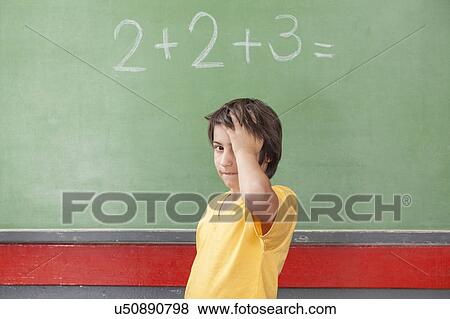 Boy worried about math View Large Photo Image Stock Photo - Boy worried about math. Fotosearch