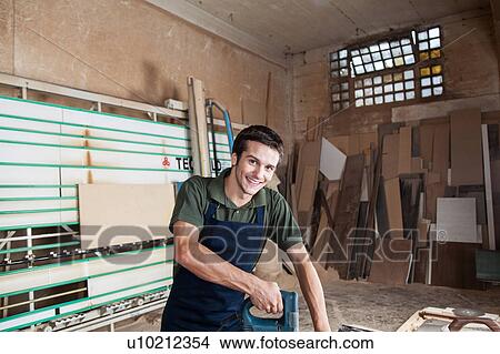 Picture - Carpenter in his workshop. Fotosearch