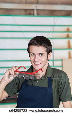 Stock Image - Carpenter with his glasses. Fotosearch