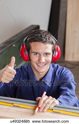 Carpenter with his thumb up View Large Photo Image Stock Photography - Carpenter with his thumb up. Fotosearch