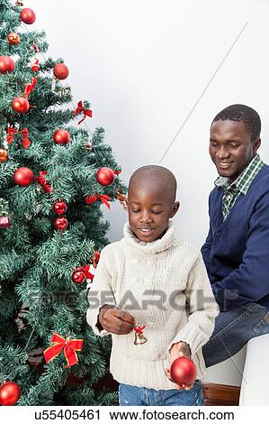 Stock Image - Child watching the Christmas decorations. Fotosearch