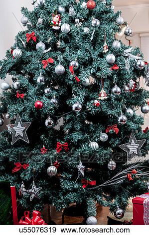 Stock Photo - Christmas tree with giftbox. Fotosearch