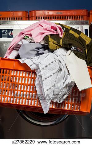 Clothes on the basket in the laundry View Large Photo Image Stock Photo - Clothes on the basket in the laundry. Fotosearch