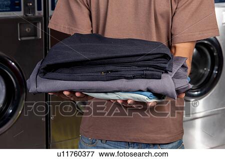 Clothes on your hands in the laundry View Large Photo Image Stock Photo - Clothes on your hands in the laundry. Fotosearch