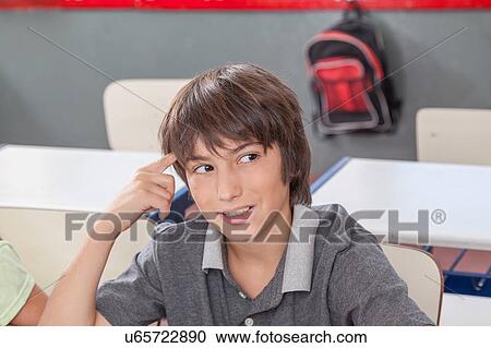 Stock Image - concentrated boy thinking. Fotosearch
