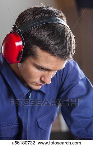 Concentrated carpenter working View Large Photo Image Stock Image - Concentrated carpenter working. Fotosearch