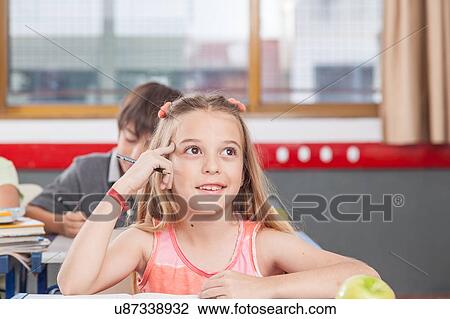 Stock Image - concentrated girl. Fotosearch