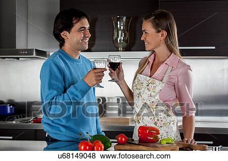 Couple cooking dinner View Large Photo Image Stock Photo - Couple cooking dinner. Fotosearch