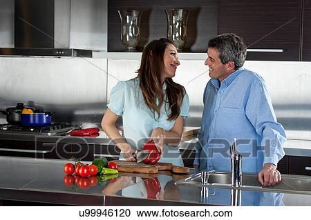 couple cooking in the kitchen View Large Photo Image Stock Image - couple cooking in the kitchen. Fotosearch