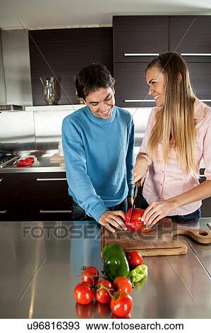 couple cutting vegetables View Large Photo Image Stock Image - couple cutting vegetables. Fotosearch