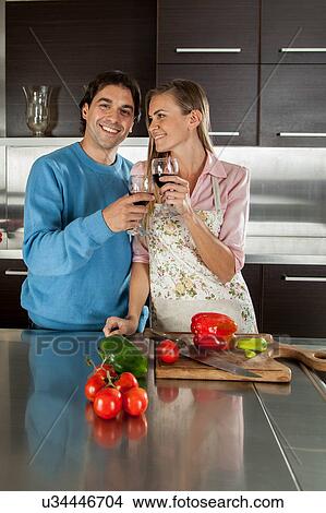 couple doing a toast View Large Photo Image Picture - couple doing a toast. Fotosearch