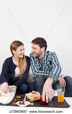 Couple having a breakfast View Large Photo Image Stock Photo - Couple having a breakfast. Fotosearch