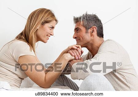 Stock Image - Couple in bed. Fotosearch