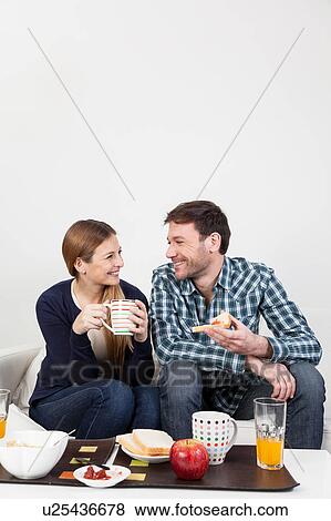 Couple in love having a breakfast View Large Photo Image Stock Photo - Couple in love having a breakfast. Fotosearch