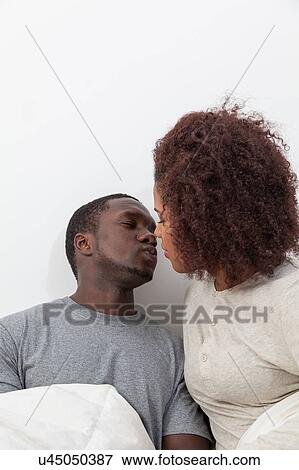 Couple in love kissing View Large Photo Image Stock Photo - Couple in love kissing. Fotosearch