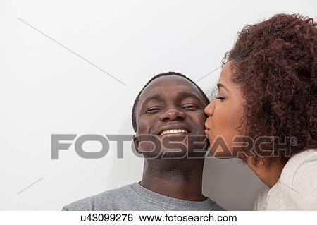 Couple in love kissing View Large Photo Image Stock Photograph - Couple in love kissing. Fotosearch