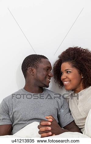 Stock Photography - Couple in love looking each other. Fotosearch
