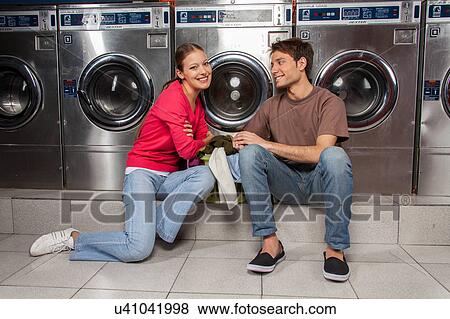 Stock Photo - Couple in the laundry. Fotosearch