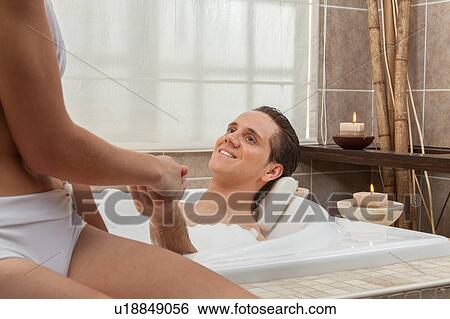 Stock Photograph - Couple in the tub. Fotosearch