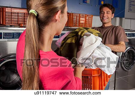 Stock Photo - Couple playing in the laundry. Fotosearch