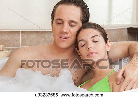 Couple relaxed in the bathtub View Large Photo Image Stock Photography - Couple relaxed in the bathtub. Fotosearch