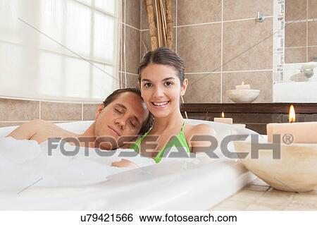 Stock Photograph - Couple relaxed in the tub of the Spa. Fotosearch